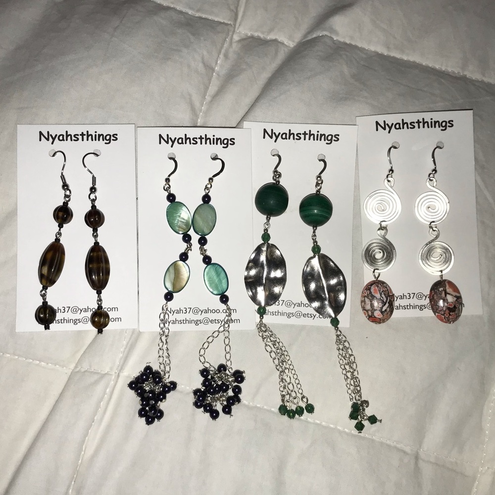 Four small dangly earrings